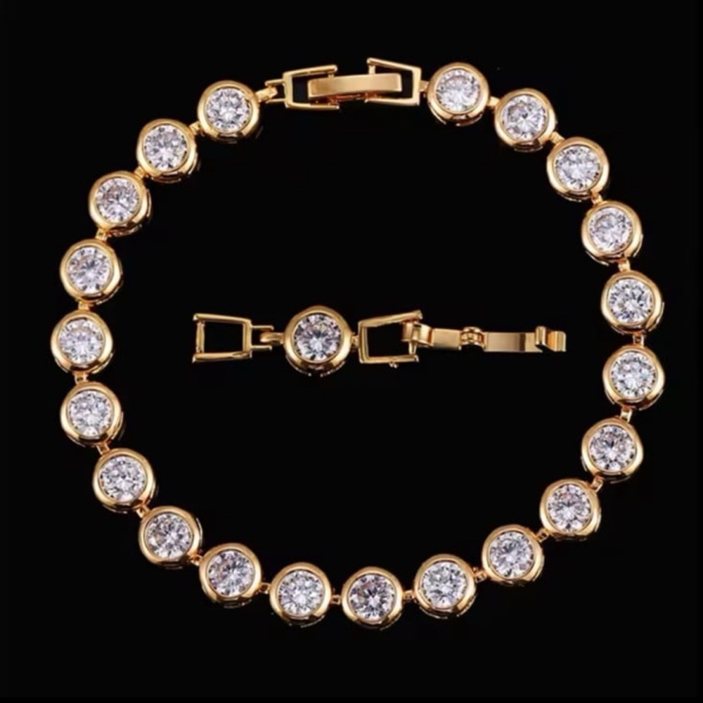 Absolutely brilliant cut swarovski elements 14kt gold plated tennis bracelet